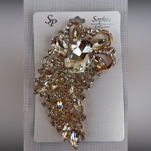 Sophia Collection clear crystals with gold tone backing, pin closure brooch, 4x2